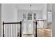 Bright foyer featuring high ceilings, and elegant wood railing at 11739 Sawgrass Ct, Fayetteville, GA 30215