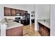 A modern kitchen with stainless steel appliances, granite countertops, and warm wood cabinets at 11739 Sawgrass Ct, Fayetteville, GA 30215