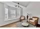 Cozy living room with bay window and comfortable seating area with natural light at 11739 Sawgrass Ct, Fayetteville, GA 30215