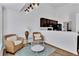 Bright living room with modern decor that opens up to the kitchen at 11739 Sawgrass Ct, Fayetteville, GA 30215