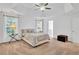 Main bedroom with a tray ceiling and large windows for plenty of natural light at 11739 Sawgrass Ct, Fayetteville, GA 30215