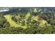 An aerial view of the golf course at Brookleigh, surrounded by mature trees at 1618 Durden Ne Rd, Atlanta, GA 30319