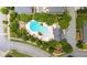 Aerial view of the community pool with chairs and tables surrounded by mature trees at 1618 Durden Ne Rd, Atlanta, GA 30319