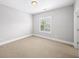 Neutral bedroom with a window and soft carpet, creating a cozy and inviting space at 1618 Durden Ne Rd, Atlanta, GA 30319