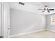 Spacious bedroom featuring a ceiling fan, neutral walls, and a bright window at 1618 Durden Ne Rd, Atlanta, GA 30319