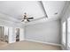 Spacious bedroom featuring a ceiling fan, carpeted floors, and plenty of natural light at 1618 Durden Ne Rd, Atlanta, GA 30319