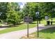 View of the Central Park sign in Brookleigh along a paved walking trail and mature trees at 1618 Durden Ne Rd, Atlanta, GA 30319