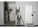 Well-maintained garage interior with water heater, EV charging station, and utility connections at 1618 Durden Ne Rd, Atlanta, GA 30319