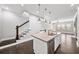 Open kitchen with island featuring stainless steel dishwasher and sink with a view to the living area at 1618 Durden Ne Rd, Atlanta, GA 30319