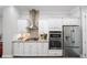 Modern kitchen with white cabinets and stainless steel appliances at 1618 Durden Ne Rd, Atlanta, GA 30319