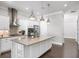 Bright kitchen with island, stainless steel appliances and pendant lighting at 1618 Durden Ne Rd, Atlanta, GA 30319