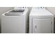 Convenient laundry room featuring a modern white front-load washer and dryer set at 1618 Durden Ne Rd, Atlanta, GA 30319