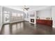 Spacious living room with hardwood floors, fireplace, built-ins, and natural light at 1618 Durden Ne Rd, Atlanta, GA 30319