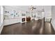 Open living space boasts hardwood floors, fireplace, built-in shelving, and kitchen access at 1618 Durden Ne Rd, Atlanta, GA 30319