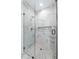 Modern shower with a glass enclosure, rain shower head, and niche for storage, and marble-look tiling at 1645 Overlook Nw Way # 9, Atlanta, GA 30318