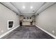 Basement wet bar features ample cabinet space, under-cabinet lighting and unique wall decor at 4020 High Gables E, Cumming, GA 30041