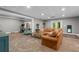 Finished basement offers a comfortable seating area, an exercise space, and outdoor access at 4020 High Gables E, Cumming, GA 30041
