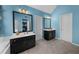 Bright bathroom features double vanities, tiled floor, and blue walls at 4020 High Gables E, Cumming, GA 30041