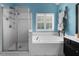 Bright bathroom featuring a glass shower, white tiled jacuzzi tub, and a unique wooden towel rack at 4020 High Gables E, Cumming, GA 30041