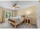 Cozy bedroom with a light wooden bed frame, a window view and light walls at 4020 High Gables E, Cumming, GA 30041