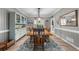 Traditional dining room with hardwood table, decorative rug, hutch, and crown molding at 4020 High Gables E, Cumming, GA 30041