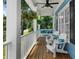 Inviting front porch featuring white Adirondack chairs and a relaxing swing at 4020 High Gables E, Cumming, GA 30041