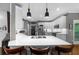 Beautiful kitchen with quartz countertops, stainless steel appliances and island seating at 4020 High Gables E, Cumming, GA 30041