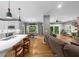 This bright open plan features stainless appliances, an island with seating and breakfast area at 4020 High Gables E, Cumming, GA 30041