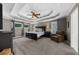 Spacious main bedroom with a tray ceiling, ceiling fan, and neutral decor at 4020 High Gables E, Cumming, GA 30041