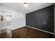 Bedroom featuring hardwood floors and a minimalist design with a single double window at 506 Bolijeri Blvd, Villa Rica, GA 30180