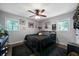Cozy bedroom with natural light and a ceiling fan, perfect for relaxation at 506 Bolijeri Blvd, Villa Rica, GA 30180