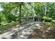 Single-story house with a light blue painted brick facade, covered carport, and concrete driveway at 506 Bolijeri Blvd, Villa Rica, GA 30180