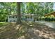 Inviting single-story home featuring a light blue painted brick facade, and a covered carport at 506 Bolijeri Blvd, Villa Rica, GA 30180