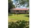 Cozy backyard with a fenced-in area and a deck, offering a private outdoor space at 393 W Freeman St, Maysville, GA 30058