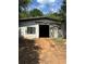 Exterior view of a large barn with sliding doors, ideal for storage or workshop space at 393 W Freeman St, Maysville, GA 30058