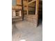 View of the horse stall, wood walls, wooden cabinet, and dirt floor inside the barn at 393 W Freeman St, Maysville, GA 30058