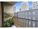 Balcony view of city buildings with potted plants, greenery and metal railings at 145 15Th Ne St # 826, Atlanta, GA 30309