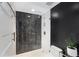Modern bathroom with glass-enclosed shower featuring bold herringbone tile and white subway tile at 145 15Th Ne St # 826, Atlanta, GA 30309