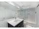 Bright bathroom featuring white subway tile, large vanity, and combination shower and tub at 145 15Th Ne St # 826, Atlanta, GA 30309