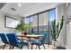 Dining room with a modern table and chairs, large windows, and an abundance of natural light at 145 15Th Ne St # 826, Atlanta, GA 30309