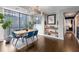 Elegant dining area with a modern table, stylish chairs, large windows, and chic decor at 145 15Th Ne St # 826, Atlanta, GA 30309