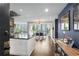Bright, open kitchen and dining area with a modern island and large windows overlooking the city at 145 15Th Ne St # 826, Atlanta, GA 30309