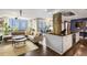 Open-concept kitchen with an island that flows to a living and dining area, perfect for entertaining at 145 15Th Ne St # 826, Atlanta, GA 30309
