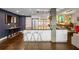 Modern kitchen with white cabinets, a large center island with seating, and stainless steel appliances at 145 15Th Ne St # 826, Atlanta, GA 30309