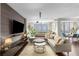 Comfortable living area with a large sectional sofa, stylish decor, and abundant natural light at 145 15Th Ne St # 826, Atlanta, GA 30309