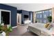 Inviting main bedroom with sleek design, large windows, a plush bed, and a modern TV console at 145 15Th Ne St # 826, Atlanta, GA 30309
