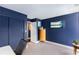 Chic home office with blue walls, closet space, and stylish furnishings at 145 15Th Ne St # 826, Atlanta, GA 30309