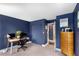 Office space with dark blue walls, modern desk, and built-in storage at 145 15Th Ne St # 826, Atlanta, GA 30309