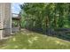 Spacious backyard with lush green lawn and wooded surroundings at 1618 Chancery Ln, Lithia Springs, GA 30122