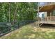 View of a lush backyard with a fence and wooded area, enhancing privacy and outdoor enjoyment at 1618 Chancery Ln, Lithia Springs, GA 30122